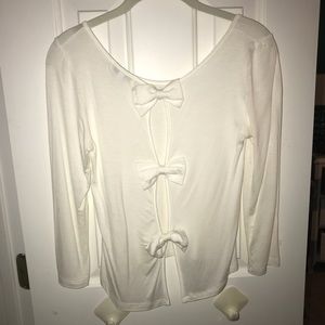 white long sleeve shirt with bows in the back